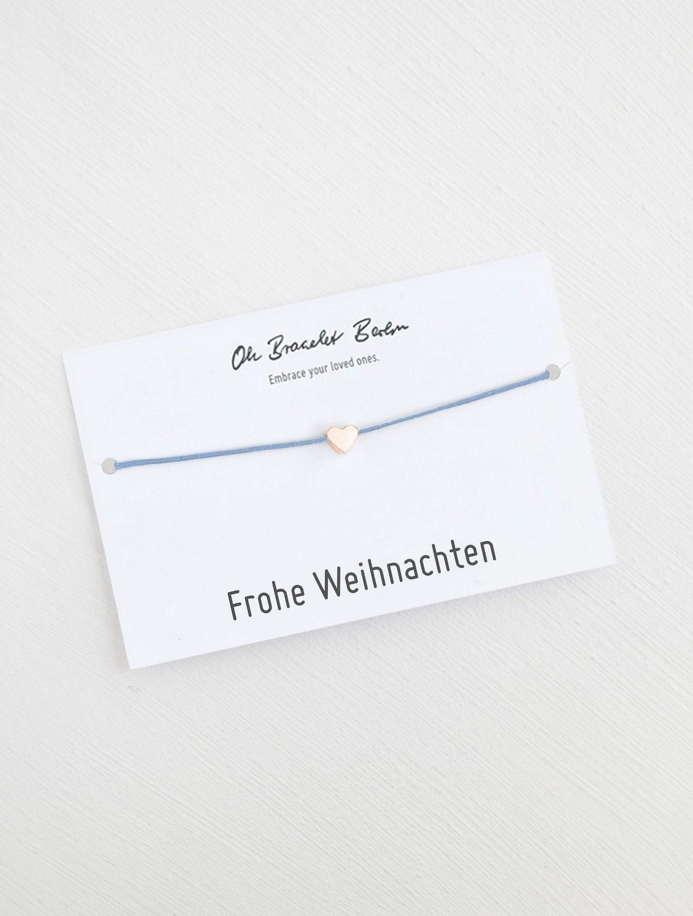 Herz Armband an Karte mit Spruch Frohe Weihnachten in der Farbe Roségold und Babyblau