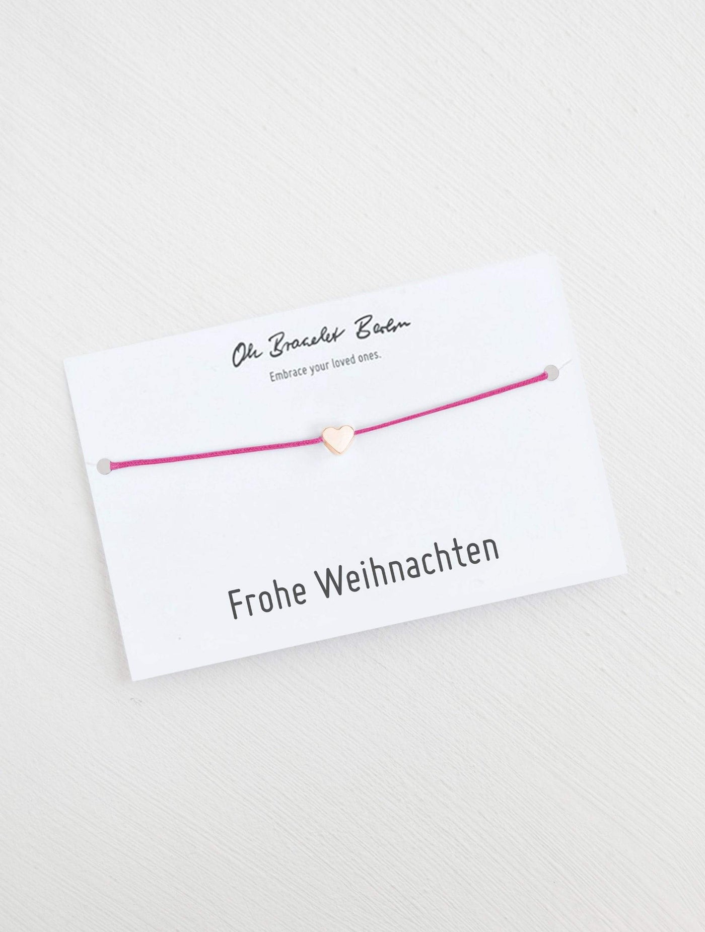 Herz Armband an Karte mit Spruch Frohe Weihnachten in der Farbe Roségold und Fucsia