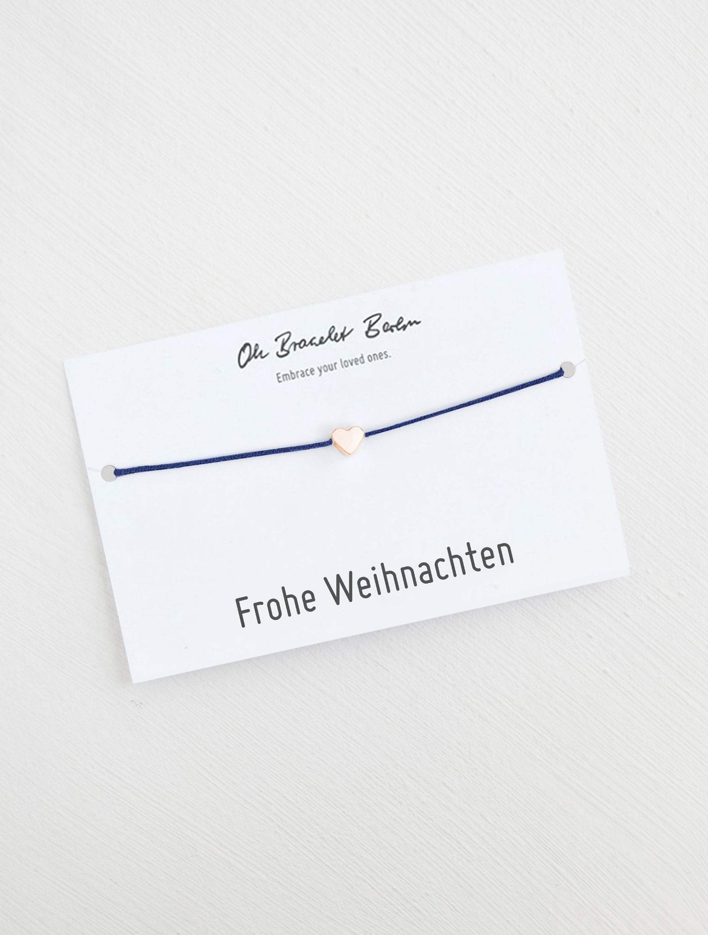 Herz Armband an Karte mit Spruch Frohe Weihnachten in der Farbe Roségold und Indigo