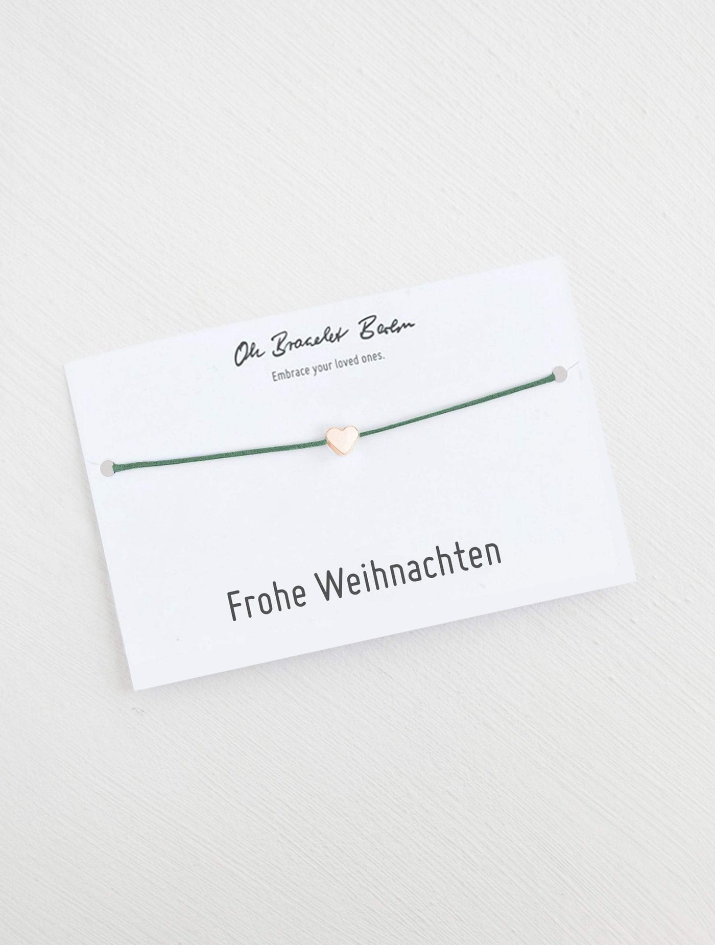 Herz Armband an Karte mit Spruch Frohe Weihnachten in der Farbe Roségold und Patinagrün