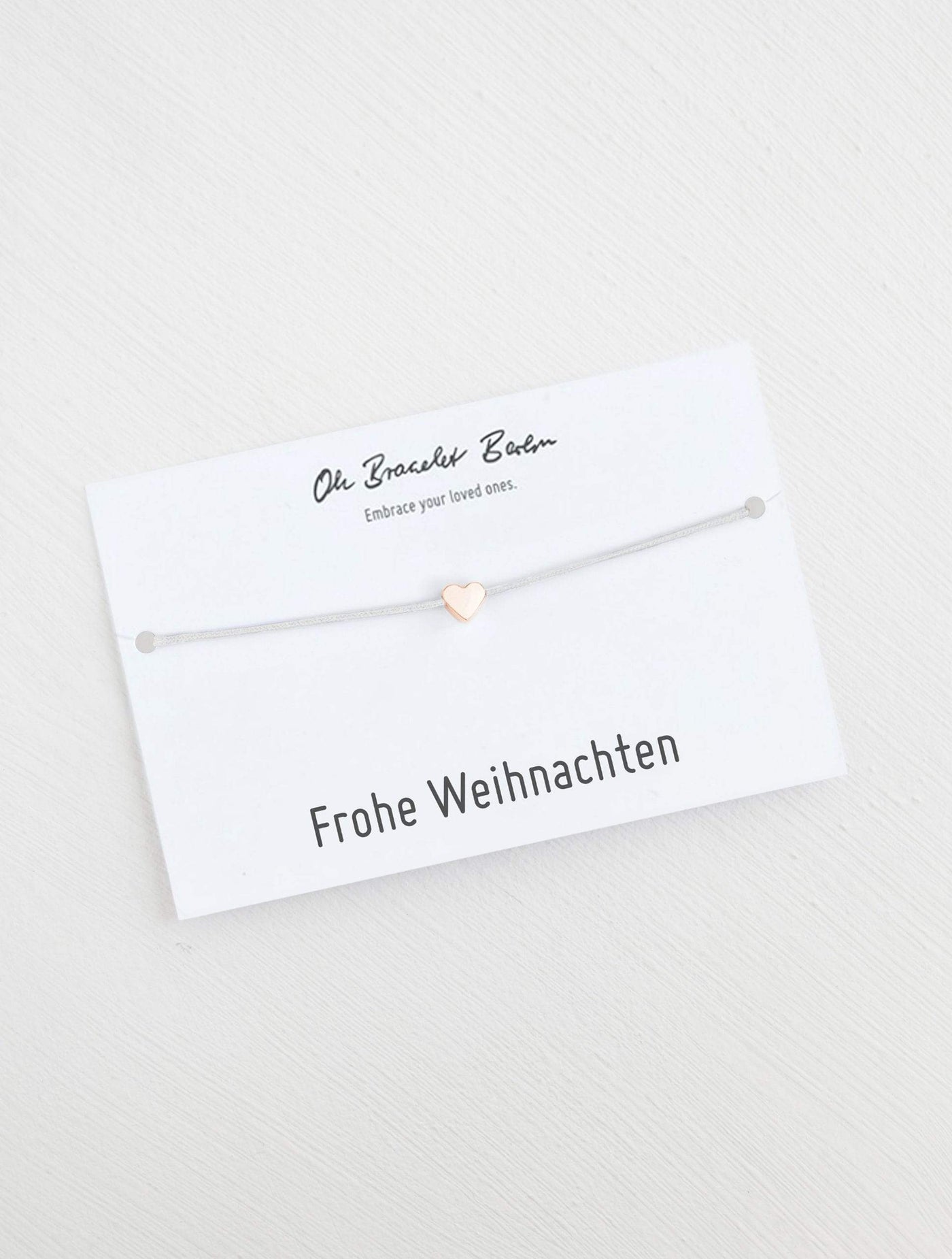 Herz Armband an Karte mit Spruch Frohe Weihnachten in der Farbe Roségold und Hellgrau